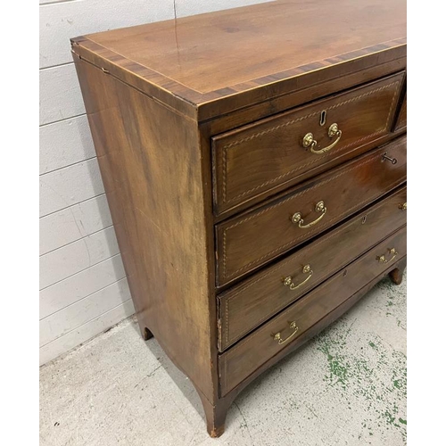 15 - An inlaid mahogany two over three chest of drawers with brass drop handles