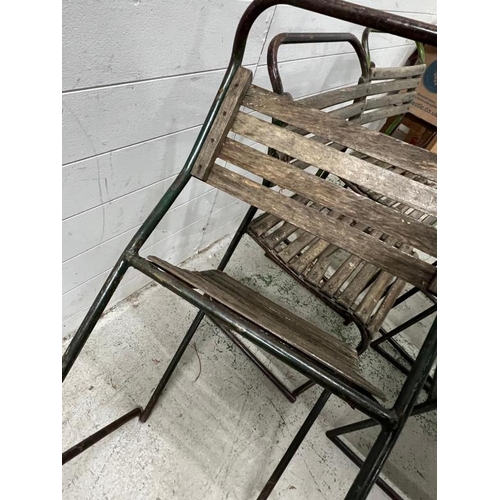 150 - A set of six PEL nesting chairs, tubular steel stacking frames with beech slats and distressed paint... 