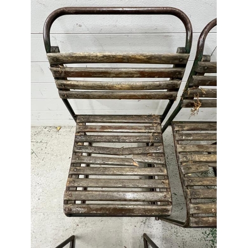 150 - A set of six PEL nesting chairs, tubular steel stacking frames with beech slats and distressed paint... 