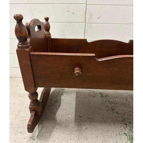 16 - A 19th Century mahogany rocking cradle with carved stars to ends