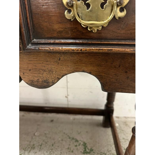 161 - An oak William and Mary style sideboard with two long drawers, brass handles and turned legs. Height... 