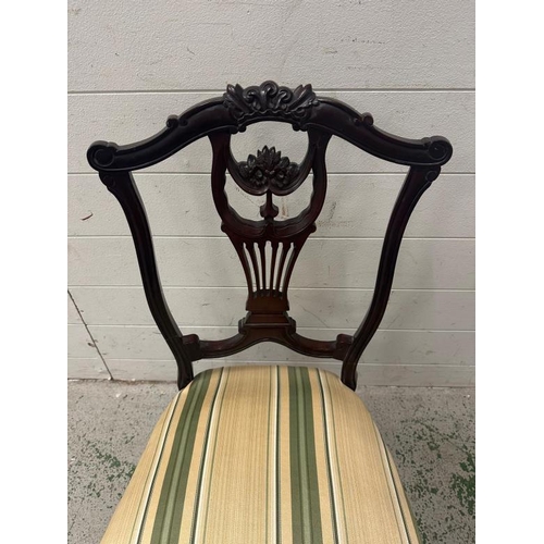 171 - A low Edwardian style lyre backed dressing table chair.