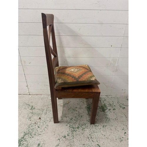 174 - A set of four cross back hardwood dining chairs