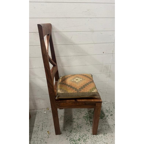 175 - A set of four hardwood cross back dining chairs