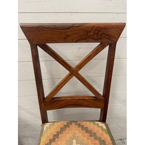 175 - A set of four hardwood cross back dining chairs