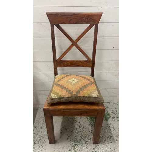 175 - A set of four hardwood cross back dining chairs