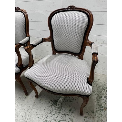 19 - A pair of Louis style open arm chairs