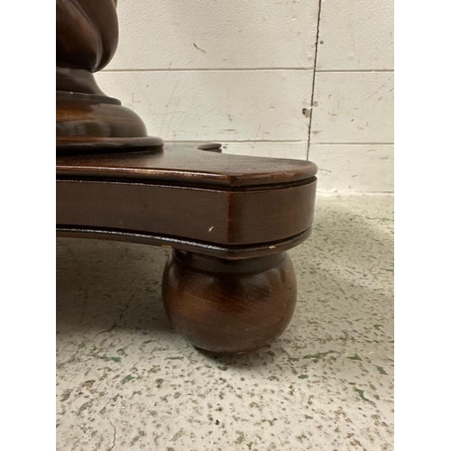 205 - A mahogany pedestal side table on spiralized turned column and four bun feet (H64cm Dia61cm)