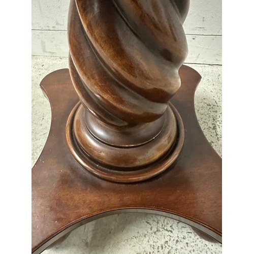 205 - A mahogany pedestal side table on spiralized turned column and four bun feet (H64cm Dia61cm)