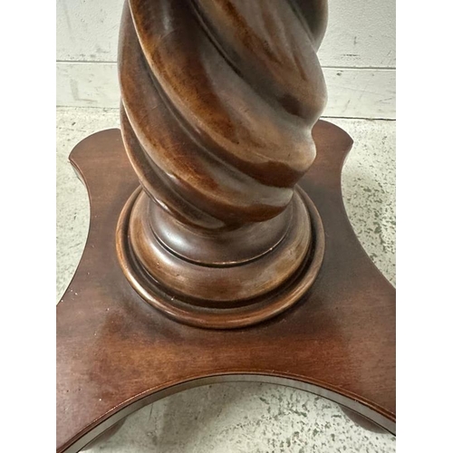 205 - A mahogany pedestal side table on spiralized turned column and four bun feet (H64cm Dia61cm)