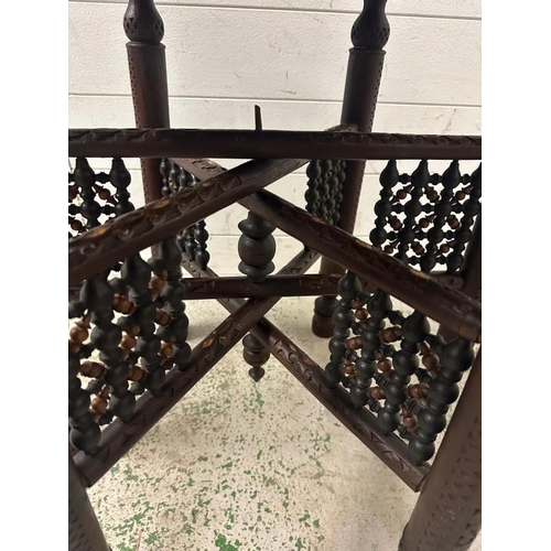 206 - A brass topped Indian tea table on folding legs with mother of pearl inlay