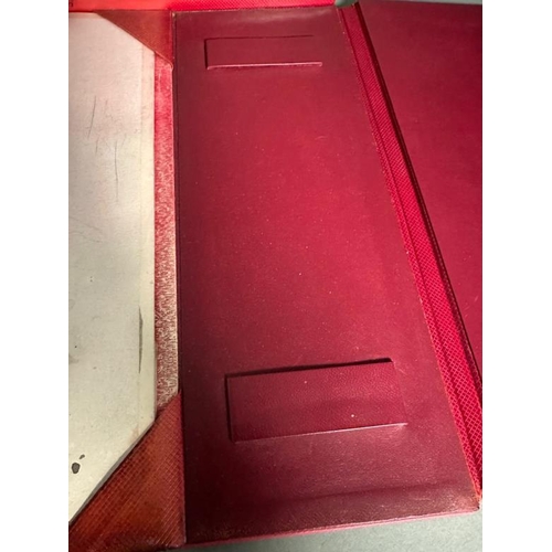 207 - A red leather desk top set comprising of a writing surface, blotters, document tray and storage pots