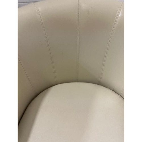 212 - A white faux leather tub chair.