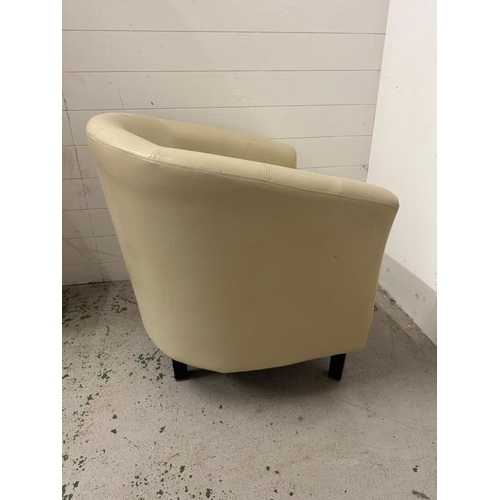 212 - A white faux leather tub chair.