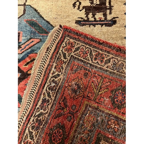 214 - Antique carpet/rug, three central medallions with a red boarder 294cm x 135cm