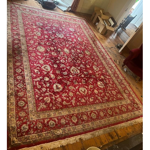 216 - A large red ground rug