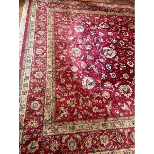 216 - A large red ground rug