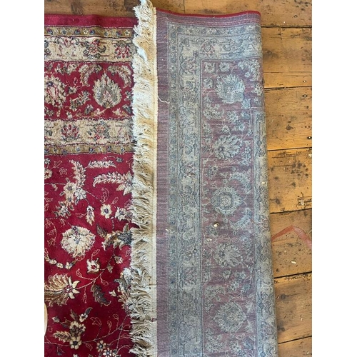 216 - A large red ground rug