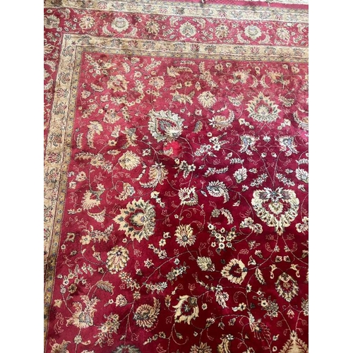 216 - A large red ground rug