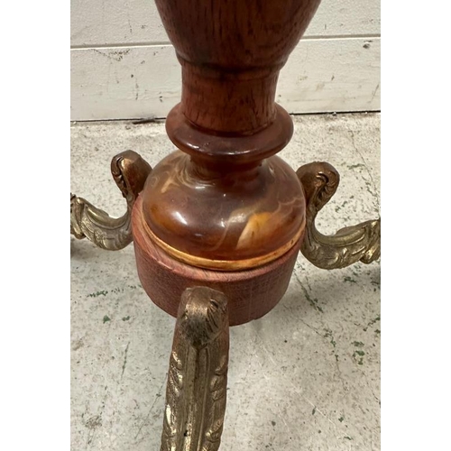 223 - An oak barley twist floor lamp on brass lions paw tripod legs