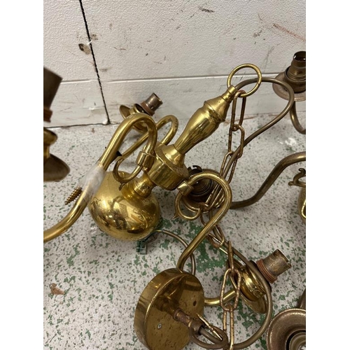 224 - A selection of four brass chandeliers or ceiling lights