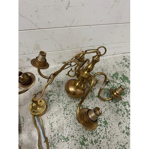 224 - A selection of four brass chandeliers or ceiling lights