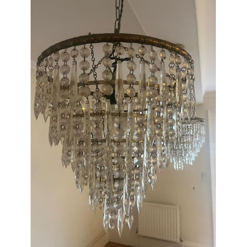 225 - A set of three waterfall chandeliers, three tier of cut glass spearhead drops