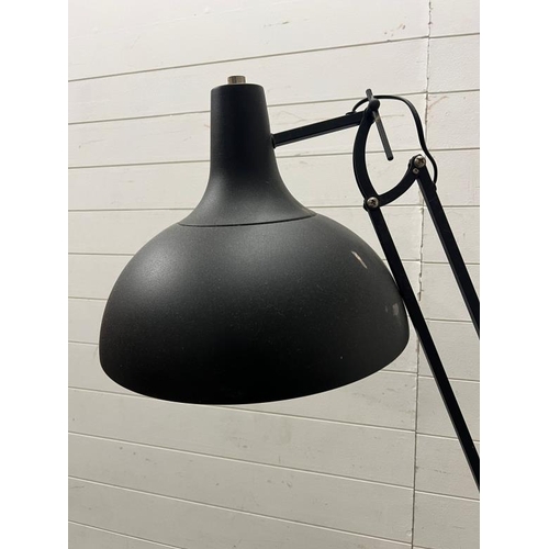 231 - An industrial style adjustable floor lamp in black