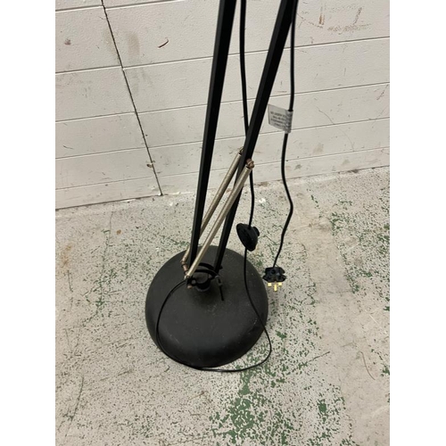 231 - An industrial style adjustable floor lamp in black