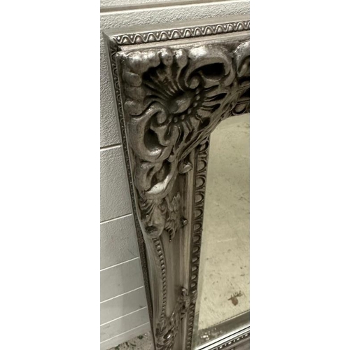 242 - A silver painted hall mirror with floral relief 115cm x 87cm