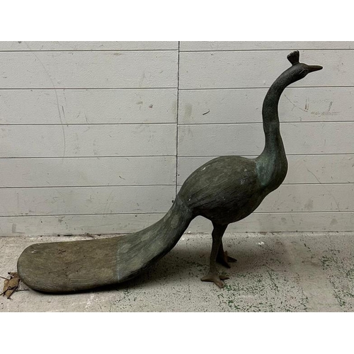 249 - A metal garden sculpture of a peacock with oxidised patina (length 116cm from beck to tail H79cm)