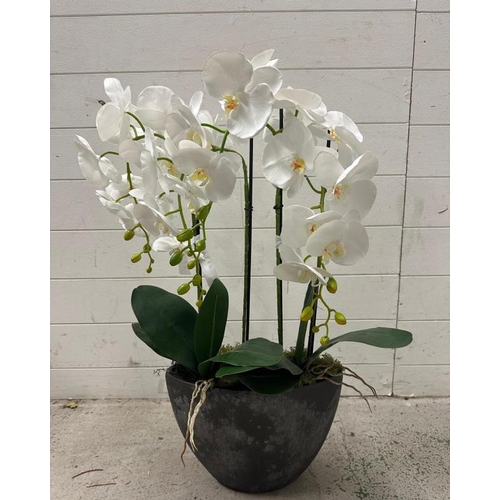 257 - A faux white lily in granite style planter