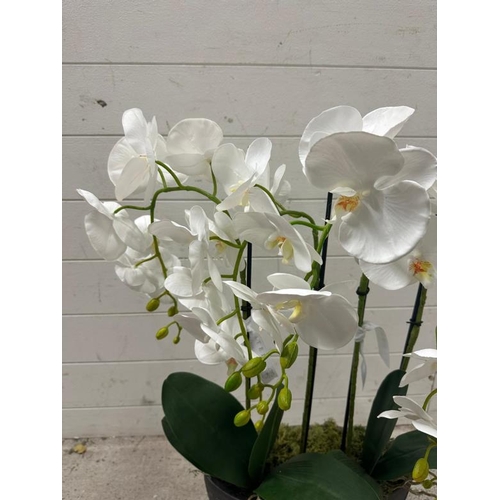 257 - A faux white lily in granite style planter