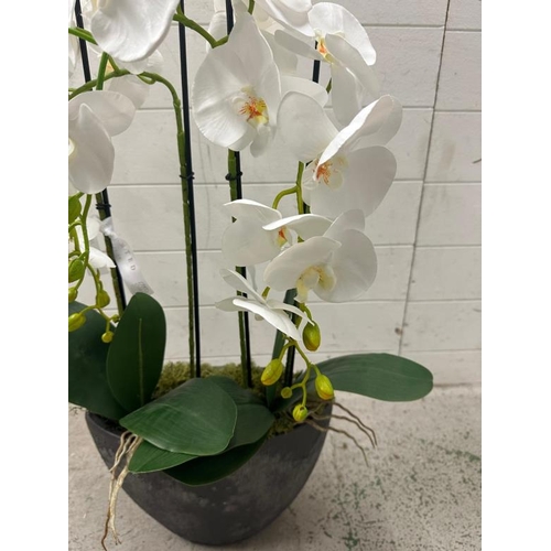 257 - A faux white lily in granite style planter