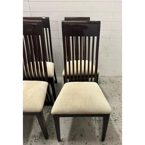 27 - A set of six contemporary stick back dining chairs upholstered in beige