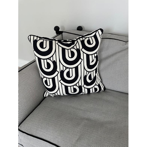 28 - A pair of Duresta two seater sofas in a black and white flecked upholstery and piped in black