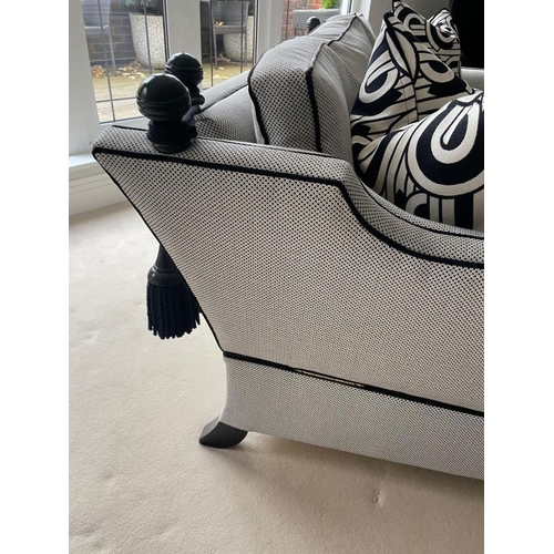 28 - A pair of Duresta two seater sofas in a black and white flecked upholstery and piped in black