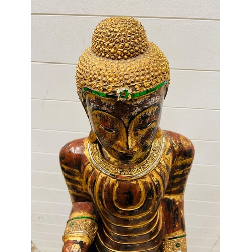 283 - A large standing Buddha in the peace pose, wooden sculpture on square base (H165cm W40cm)