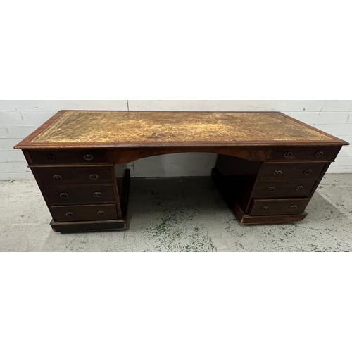 3 - A mahogany pedestal desk with leather top (H74cm W133cm D70cm)