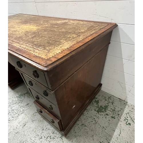 3 - A mahogany pedestal desk with leather top (H74cm W133cm D70cm)