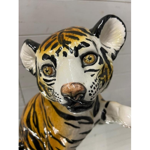 306 - A ceramic decorative tiger cub H42cm