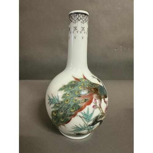 315 - A bottle nosed Chinese vase with peacock decoration