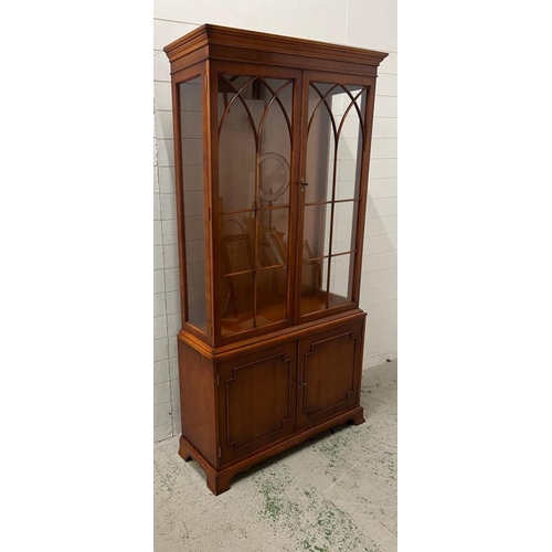 32 - A Bradley display cabinet with cupboard under (H197cm W102cm D34cm)