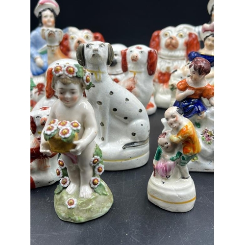 325 - A selection of fourteen Staffordshire figures various themes