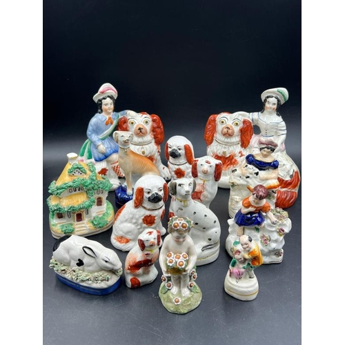 325 - A selection of fourteen Staffordshire figures various themes