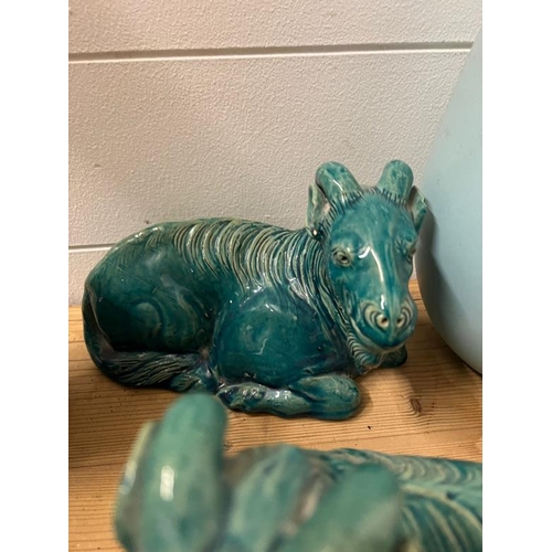 329 - A collection of ceramics to include a pair of Goats and vases all in Teal