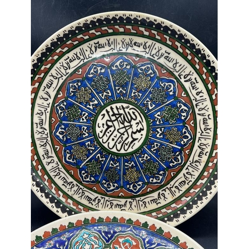 332 - Two Islamic ceramic wall hanging plates