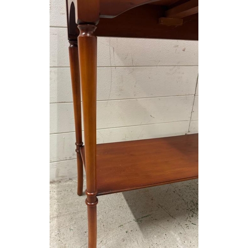 35 - A two drawer veneered side table with shelf under and on turned legs (H76cm W66cm D32cm)