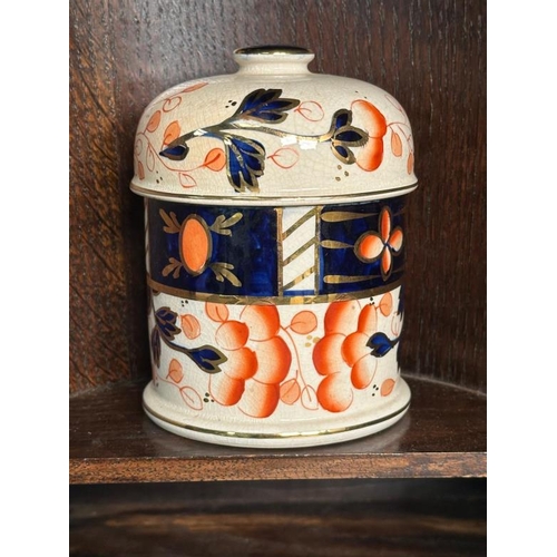 385 - A Victorian carved oak smokers cabinet, bevel glazed and complete with ceramic tobacco jar and clay ... 