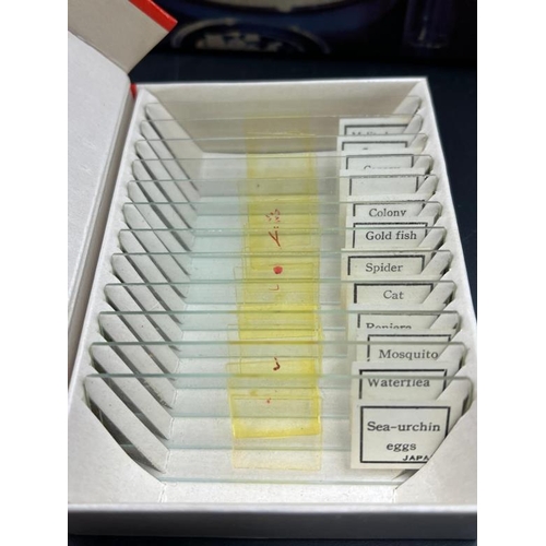 391 - A Thomas Salter Microscope Lab $ along with several boxes of slides, including prepared slides of an... 